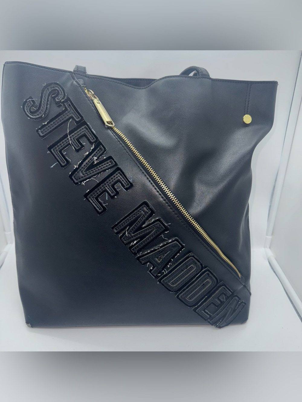 Steve Madden Black Tote with Diagonal Gold Zip and Logo